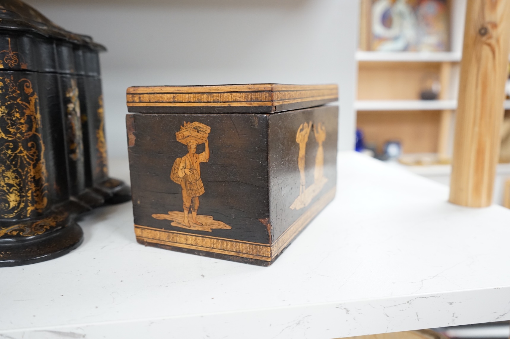 A large Victorian Papier maché and mother-of-pearl tea caddy, 32cm wide, and a Sorrento ware marquetry tea caddy, 19.5cm wide.
